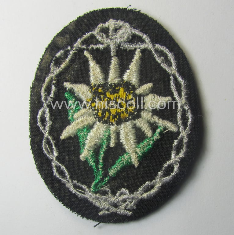 WH (Heeres) EM- (ie. NCO-) type: 'Edelweiss'-armpatch (being a machine-embroidered specimen)