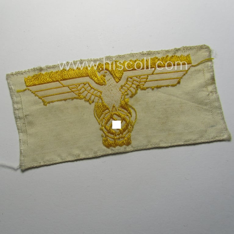 'Variant'-pattern, WH (KM) EM- (ie. NCO-) type side-cap-eagle (ie. 'Schiffchenadler für Mannschaften u. Uffz. der KM') in the 'BeVo'-weave-pattern as was specifically intended for usage on the various white-coloured side-caps
