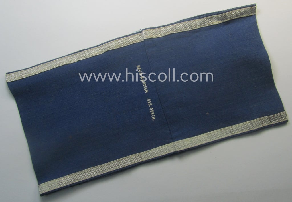 Darker-blue-coloured, RLB (or: 'Reichsluftschutzbund') so-called: 'Amtsträger-Armbinde für Führer' depicting the typical 'RLB'-logo (with lettering) and that comes in a just moderately used- ie. worn, condition
