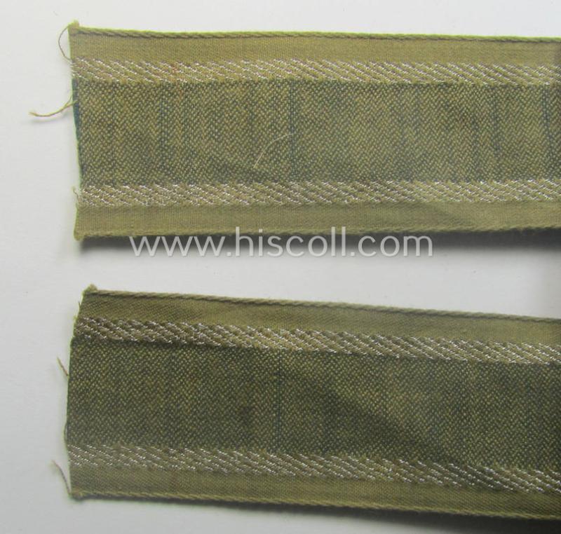 'BeVo'-like cuff-title (ie. 'Ärmelstreifen') entitled: 'Afrikakorps' being a presumably issued but simply never worn example that comes in an overall very nice- (ie. non-shortened- and never tunic-attached-), condition