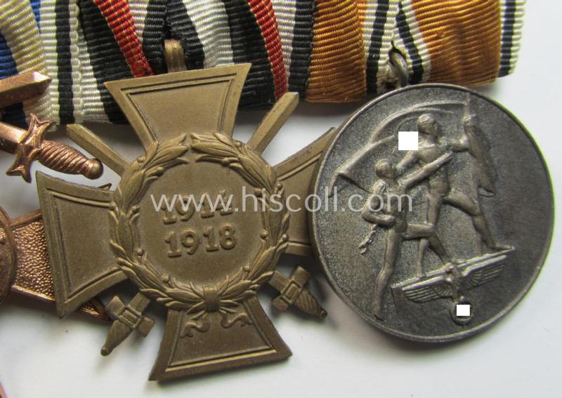 Attractive, 4-pieced medal-bar (ie. 'Ordenspange') respectively depicting a WWI-period: 'EK II. Klasse', a: 'Bayern Militär-Verdienstkreuz 3. Klasse m. Schw.', a: 'FKK 1914-18 m. Schw.' and an: Austrian 'Anschluss'-medal