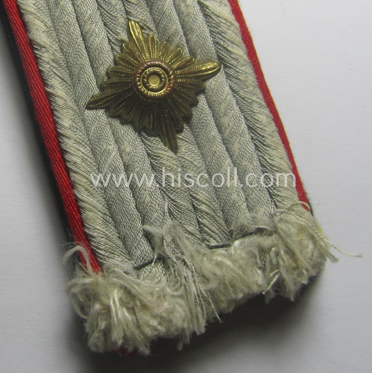 Neat - albeit regrettably single! - Waffen-SS officers'-pattern shoulderboard as piped in the bright-red-coloured branchcolour as was intended for usage by an: 'SS-Obersturmführer' who served within the: 'Waffen-SS (Sturm)Artillerie-Trpn.'