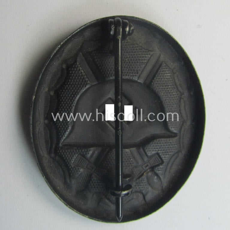 Maker- (ie. I deem '118'-) marked example of a black-class wound-badge (or: 'Verwundeten-Abzeichen in Schwarz') being an example that was produced by the (Austrian-based) maker (ie. 'Hersteller') named: 'August Menze & Sohn'