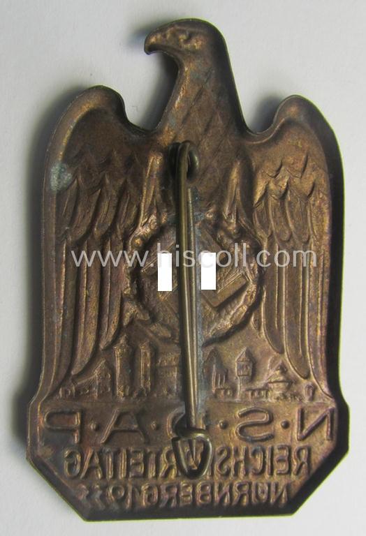 N.S.D.A.P.-related 'tinnie' (ie. 'Tagungs- o. Veranstaltungsabzeichen'-) being a non-maker-marked, 'hollow-back'-pattern and/or golden-bronze-toned example showing the text: 'N.S.D.A.P. Reichsparteitag - Nürnberg 1933'