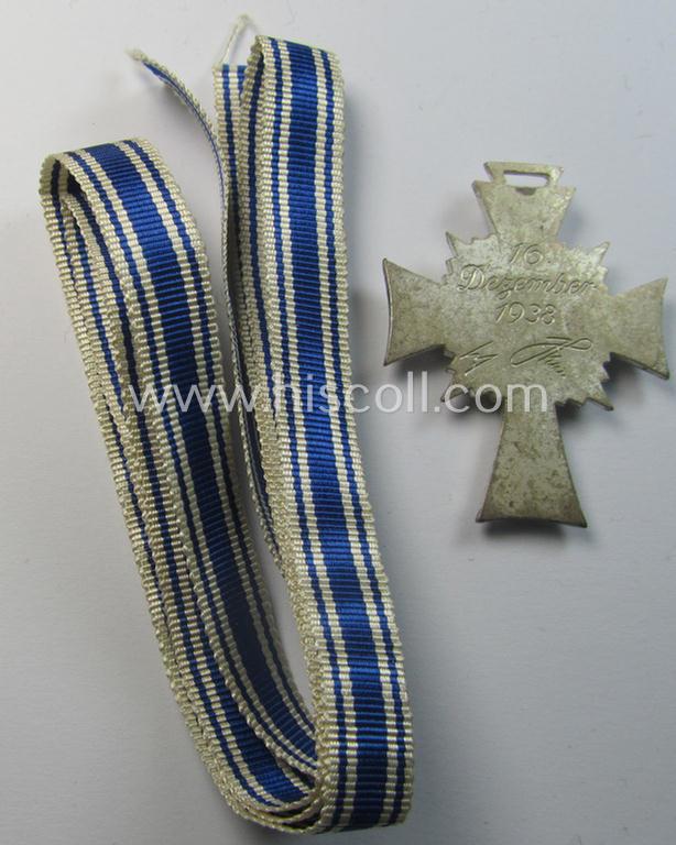 Attractive, 'Ehrenkreuz der deutschen Mutter - zweite Stufe' (or: silver-class mothers'-cross) being a hardly (ie. never!) used example that comes together with its accompanying, long-sized (& minty) ribbon as issued and/or recently found