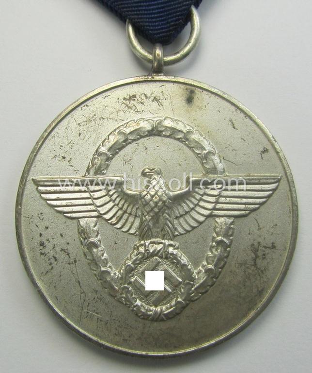 Bright-silver-toned so-called: 'Polizei-Dienstauszeichnung 3. Stufe' (or: police loyal-service medal 3rd class) that comes mounted onto its period ribbon (ie. 'Bandabschnitt')