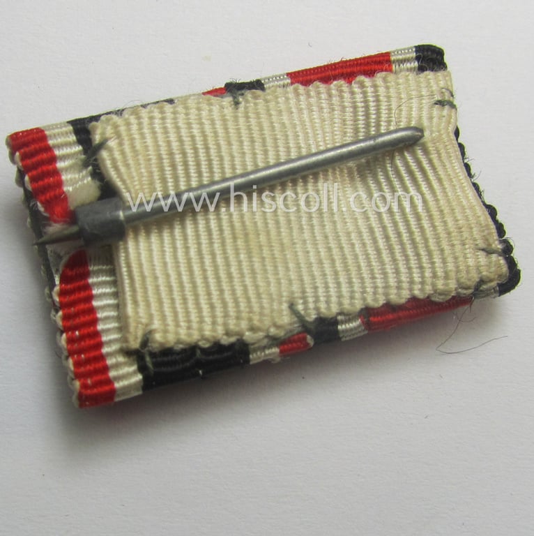 Neat - and simply never issued- nor worn! - dual-pieced WWII-period ribbon-bar (ie. 'Feld- o. Bandspange') as was intended for combination: 'Eisernes Kreuz II. Klasse' (or: iron cross second class) and 'KvK II. Klasse mit Schwertern'