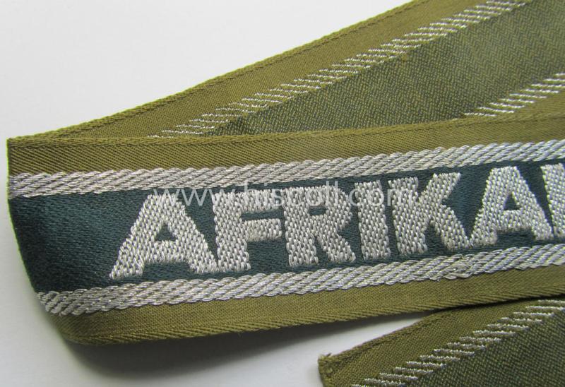 Superb, 'BeVo'-like cuff-title (ie. 'Ärmelstreifen') entitled: 'Afrikakorps' being a presumably issued but never worn example that comes in an overall very nice- (ie. non-shortened- and never tunic-attached-), condition