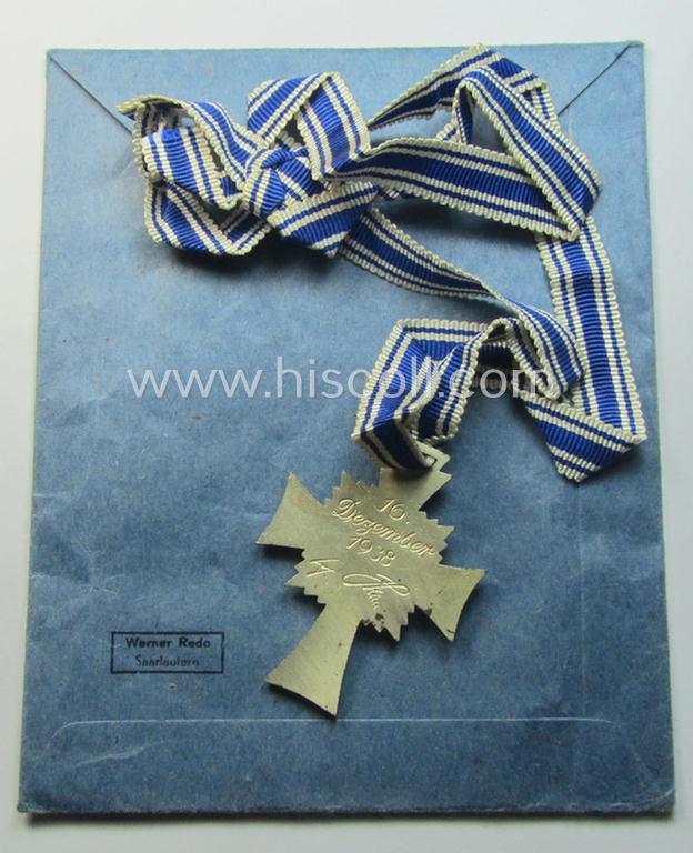 'Ehrenkreuz der deutschen Mutter - zweite Stufe' (or: silver-class mothers'-cross) that came mounted onto its long-sized ribbon and that came stored in its period pouch by the (unusual!) maker: 'Werner Redo - Saarlautern'