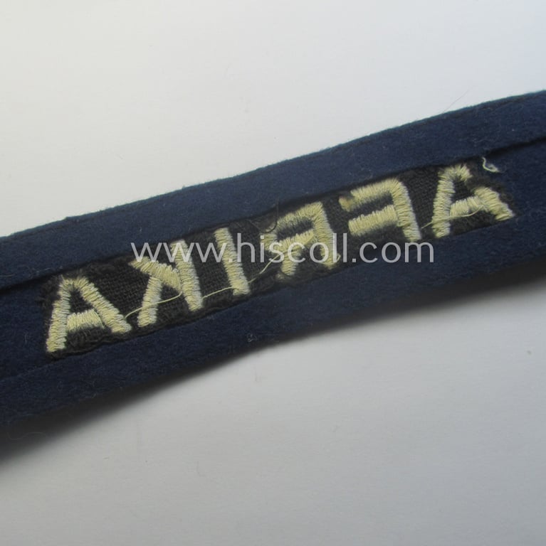 Darker-blue toned, WH (Luftwaffe) cuff-title (ie. 'Ärmelstreifen') entitled: 'Afrika' (being a full-length example that comes in an issued-, used and/or carefully tunic-removed, condition)