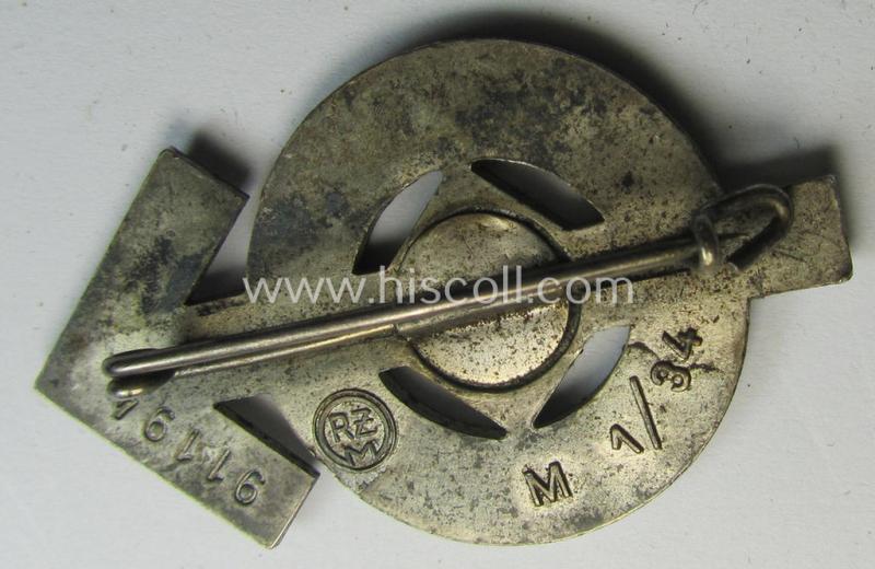 Attractive, HJ- (ie. 'Hitlerjugend'-) sports-badge (or: 'HJ-Leistungsrune') of the silver-class being a clearly maker- (ie. 'RzM - M1/34'-) marked- and/or: 'Buntmetall'-based specimen that shows an engraved (unique) bearers'-numeral ('91194...