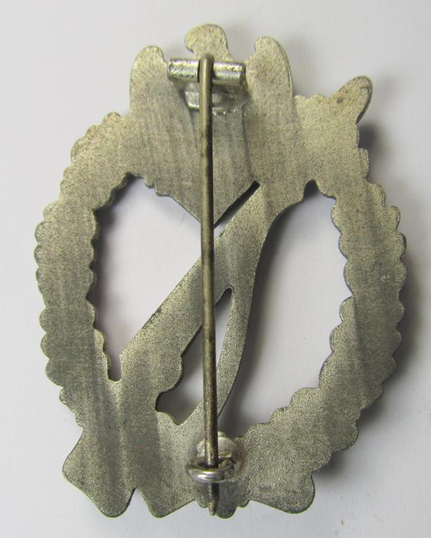 'Infanterie-Sturmabzeichen in Silber' being a non-maker-marked- and/or zinc- (ie. 'Feinzink'-) based specimen of the so-called: 'egg-head'-pattern (as was presumably produced by the 'Hersteller' ie. maker: 'Gustav Brehmer')