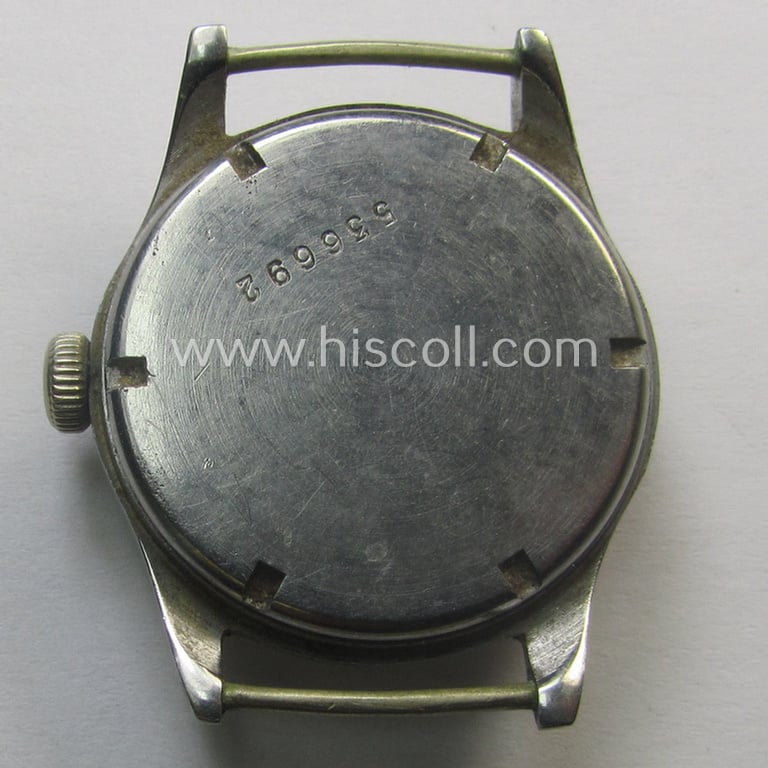 WH (Kriegsmarine) WWII-period wrist-watch (or: 'Dienstuhr') of the make: 'K.M. Zentra' having a beige-yellow-coloured dial-plate and neatly engraved number on its back that reads: '536692'