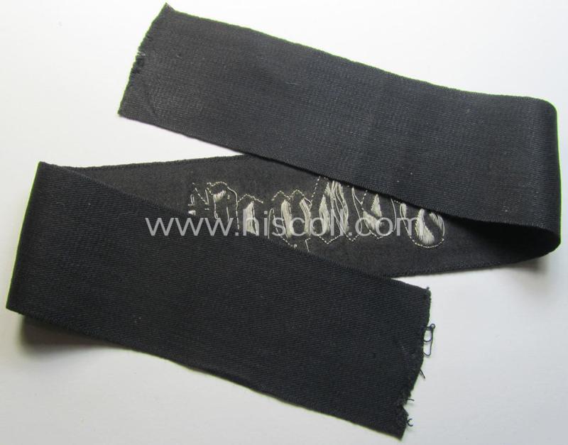 Superb - and most certainly rarely seen! - WH (Heeres) related cuff-title (ie. 'Ärmelstreifen für Führer') being a typical black-coloured- and linnen-based example showing the (neatly silver-toned- and 'flatwire'-woven!) text that reads: 'Feldpo...