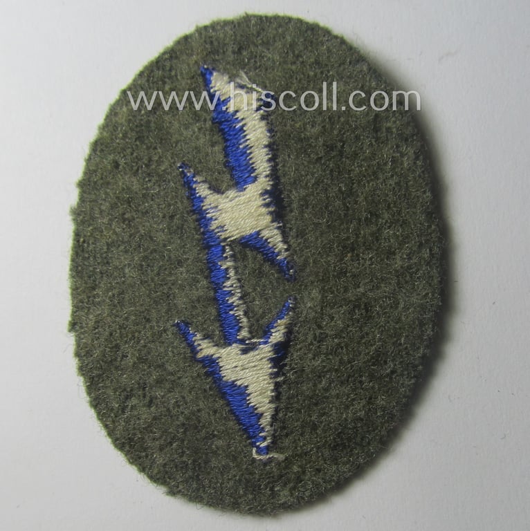 WH (Heeres) trade- and/or special-career-insignia (ie. machine-embroidered 'signal-blitz') example as executed in darker-blue-coloured linnen as was specifically intended for a soldier within the: 'Sanitäts-Trpn.'