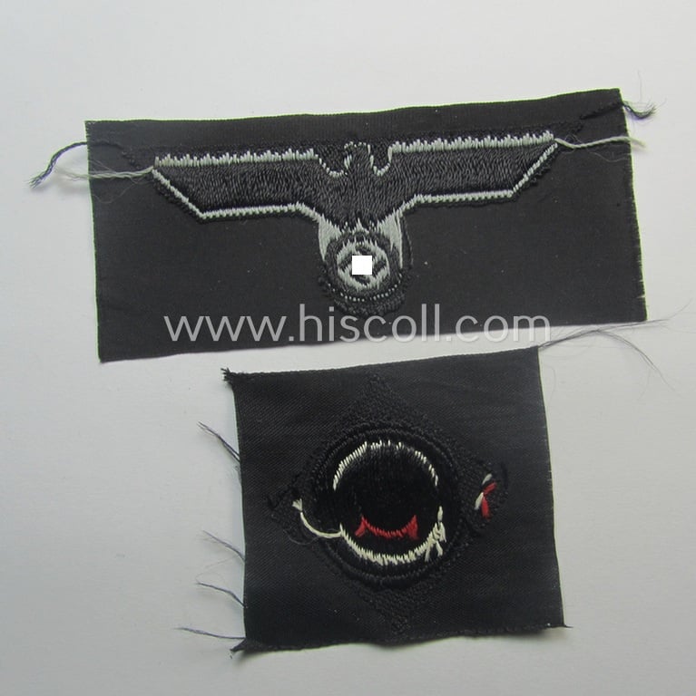 Mid-war-period, WH (Heeres) 'Panzer' cap-eagle & cocarde-set (ie. 'Schiffchenmützen-Adler u. Kokarde-Satz für Mannschaften u. Uffz.') being a 'virtually mint' set as executed in bluish-grey-coloured linnen onto a black-coloured background