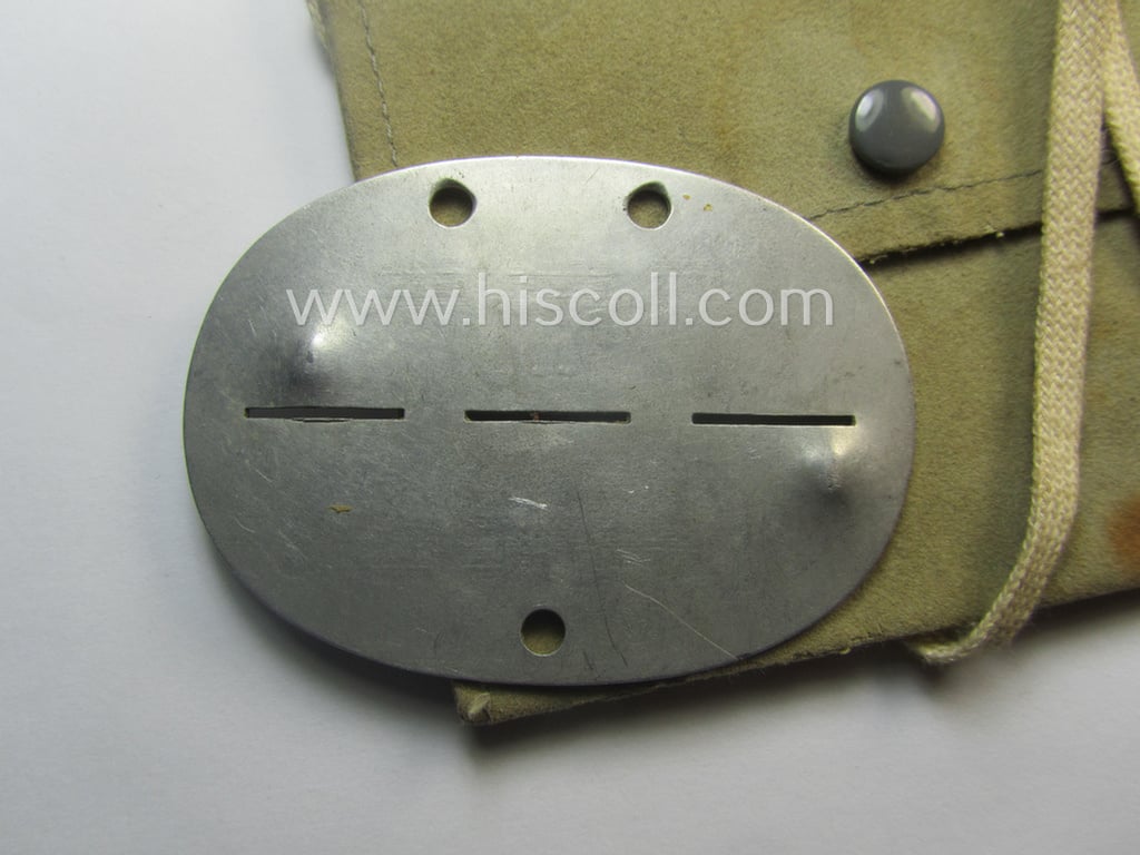 Aluminium-based, WH (Heeres-) signals'- (ie. 'Nachrichten'-) related ID-disc bearing the clearly stamped unit-designation: '3./N.Ers.Abt. 9' and that comes stored in its period-pouch as issued and/or worn