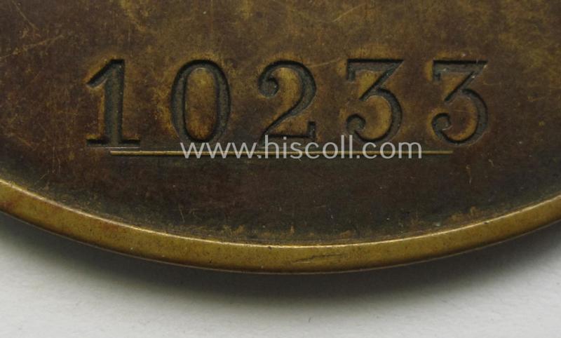 Stunning - and actually very rarely encountered! - copper-toned ID-disc (ie. 'Dienstmarke') entitled: 'Staatliche Kriminalpolizei' showing a pronounced eagle-device and bearing the unique, engraved serial- ie. bearers'-number that reads: '10233...
