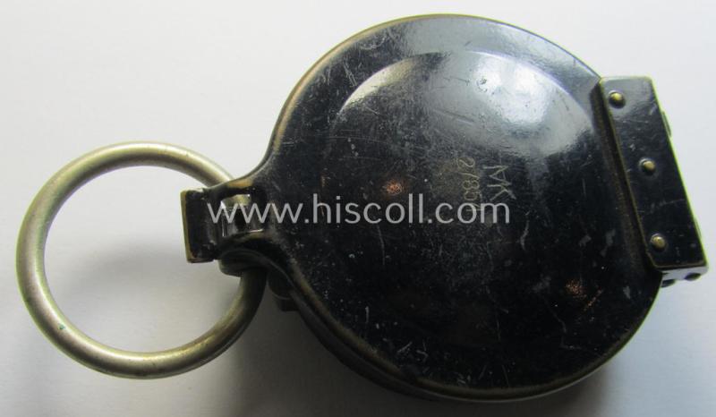 Superb, 'standard-issue'-pattern, black-coloured and/or copper-based WH-compass (ie. 'Marschkompass') which is nicely 'MK'-marked and/or individually numbered: '27854' and that comes mounted onto its period 'Fangschnur'