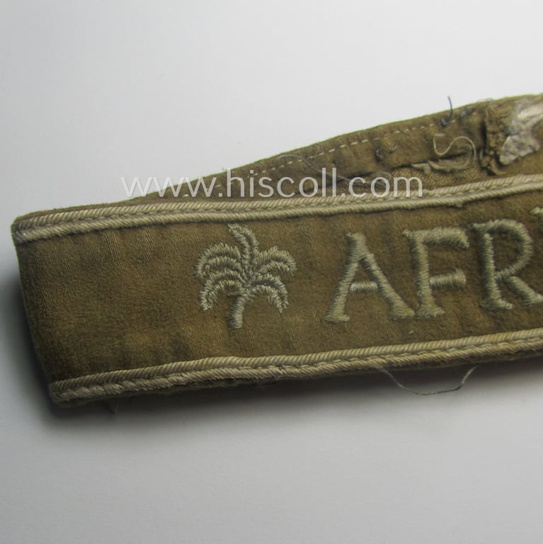 Cleary worn, WH cuff-title (ie. 'Ärmelstreifen') entitled: 'Afrika' (that bears a printed 'RbN.'-numeral!) being a minimally shortened example that comes in an overall very nice- (ie. issued and clearly worn ie. once tunic-attached-), condition