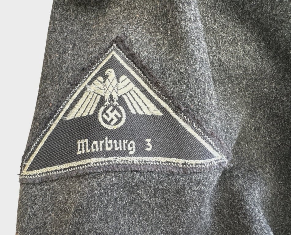 DRK (Deutsches Rotes Kreuz)  Vorhelfer service tunic with original insignia and armband.