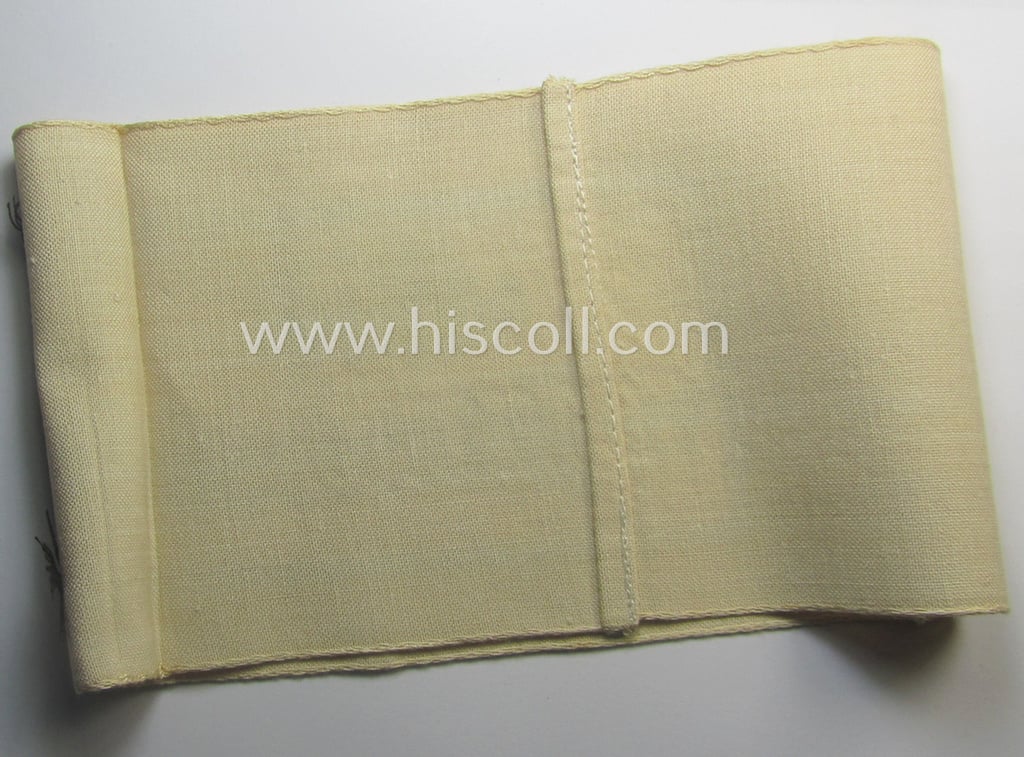 Beige-white-coloured- and/or linnen-based armband (ie. 'Armbinde') as was executed in the 'thicker-styled' fabric as was intended for WH (Heeres) staff-members working as: 'Hilfs-Krankenträger'
