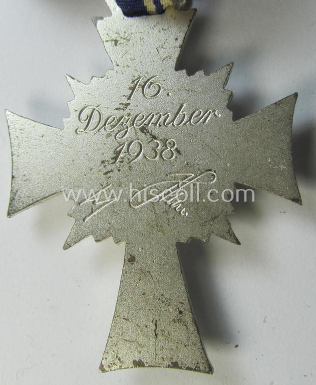 Superb, 'Ehrenkreuz der deutschen Mutter - zweite Stufe' being a non-maker-marked example that comes mounted onto its (large-sized!) ribbon and that comes in an overall very nice- (albeit minimally worn- ie. used-), condition