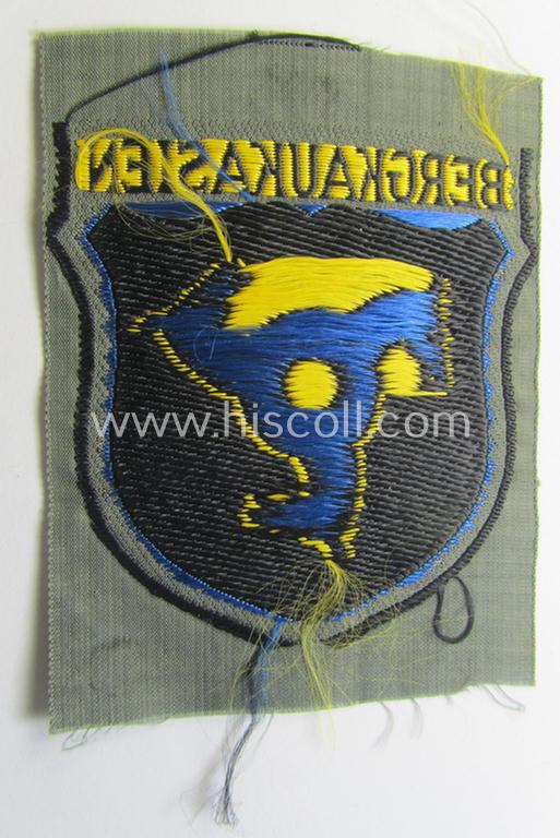 Attractive, 'BeVo'-type armshield (of the second pattern-) entitled: 'Bergkaukasien', being a piece as intended for a volunteer who served within the 'Deutsche Wehrmacht' ie. within the 'Berg- o. Nord-Kaukasisches Legion'