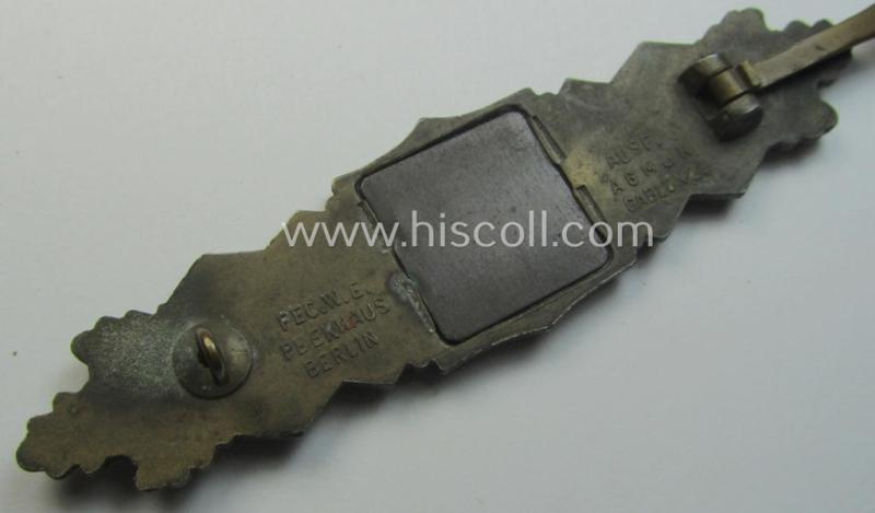 'Nahkampfspange in Bronze' (or: bronze-class close-combat clasp ie. CCC) being a maker- (ie. 'A.G.M.u.K.'-) marked- and/or minimal converse-shaped specimen having its period-attached (steel-based) 'back-plate' in place