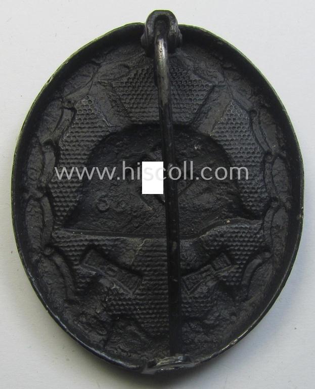 Black-class wound-badge (or: 'Verwundeten-Abzeichen in Schwarz') being a neatly maker- (ie. '65'-) marked example that was produced by the maker (ie. 'Hersteller') named: 'Klein & Quenzer'