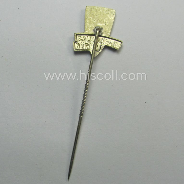 Commemorative lapel-pin (ie. 'Veranstaltungsabzeichen') being a maker- (ie. 'Balmberger-Nürnb.'-) marked example depicting a swastika-device coupled with the text: 'Deutsche Kampfspiele - Nürnberg - 1934'