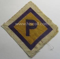 Printed-version of a so-called: 'P'- (ie. forced-labour) breast-patch...