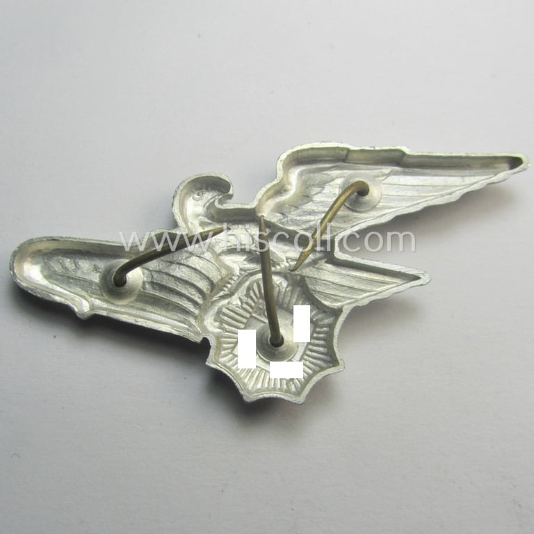 Officers'- (ie. evt. NCO-) pattern, aluminium-based so-called: 'Luftschutz' (ie. RLB-) visor-cap eagle being a maker- (ie. 'HA'-) marked example as was produced by the 'H. Aurich'-company