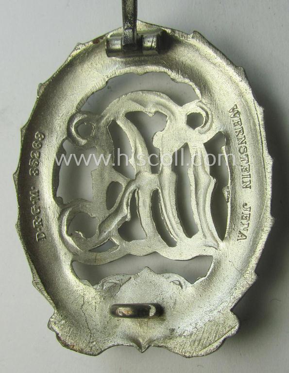 'Virtually mint' example of a: 'Reichssportabzeichen DRL in Silber' (or: DRL sports'-badge in silver) being a just moderately worn- ie. used example that is nicely maker- (ie. 'Wernstein - Jena'-) marked on its back