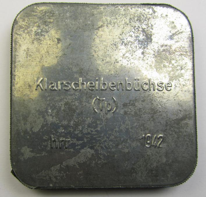 Unusal WH-equipment-item: a metal-based, square-sized box holding a pair of replacement gasmask-lenses for tropical-usage (ie. 'Klarscheibenbüchse - Tp') being a mint- ie. unissued example that bears a 3-digit maker-code ('hrr') and/or date: '19...