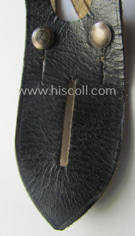 'Standard-issue'-pattern (albeit thinner-shaped ie. 'Panzer'!) WH binoculars (ie. 'Dienstglas 6 x 30 o. 10 x 50') so-called: 'anti-movement flap' (or: 'Tragelasche für Dienstgläser') as was executed in black-coloured leather