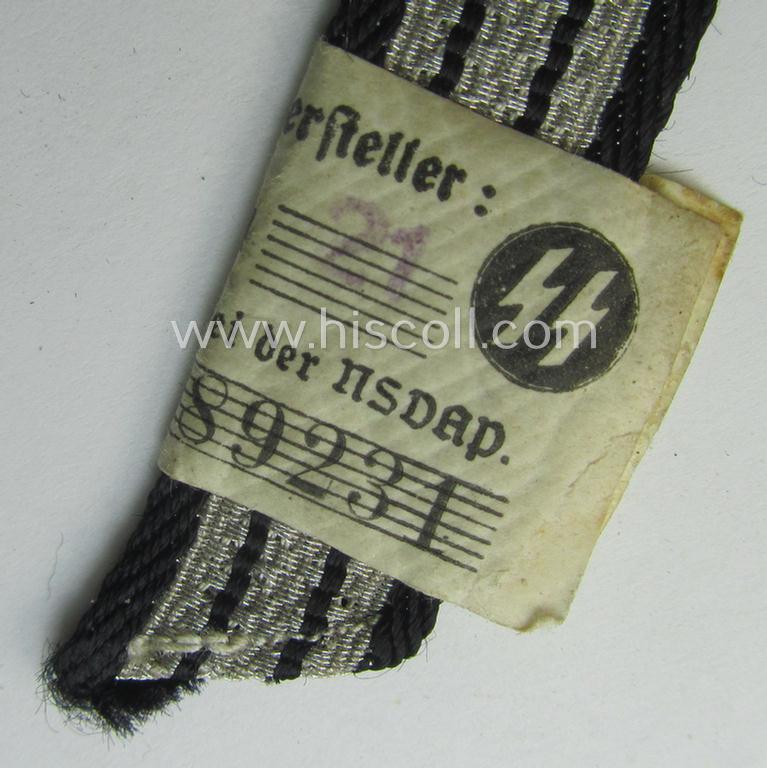 SS (ie. 'Allgemeine o. Waffen-SS') arm-insignia being an 'SS', so-called: 'Ehrenwinkel für Altgediente Kämpfer o. Angehörigen der SS' (or: honorary-chevron for old campaigners) still retaining its period 'RzM'-etiket