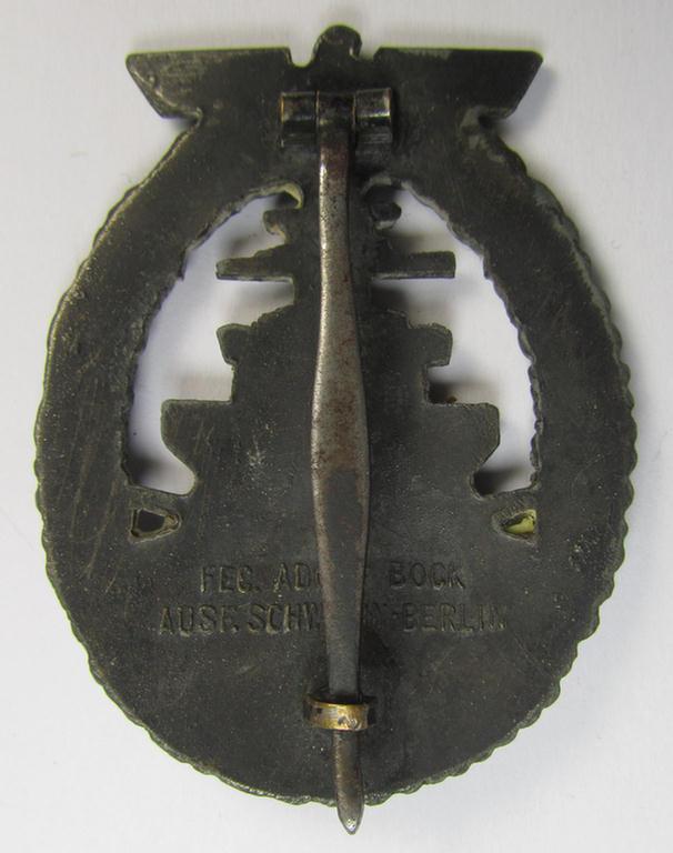 WH (Kriegsmarine) 'Flottenkriegsabzeichen' (or: high-sea fleet badge) being a typical zinc- (ie. 'Feinzink'-) based and/or (I deem) later-war-period version that is neatly maker- (ie. 'Fec. Adolf Bock') marked on its back