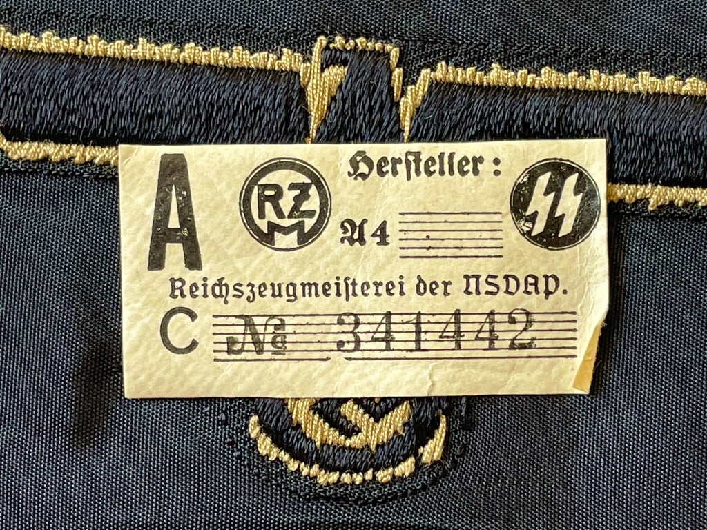 WWII GERMAN WAFFEN SS ARM EAGLE WITH SS PAPER ISSUED RZM TAG REMAINING.