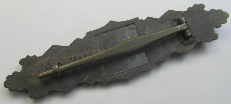 'Nahkampfspange in Bronze' (or: bronze-class close-combat clasp ie. CCC) being a neatly maker-marked- and/or minimally converse-shaped specimen as was produced by the: 'JFS'- (ie. 'Joseph Feix u. Söhne'-) company
