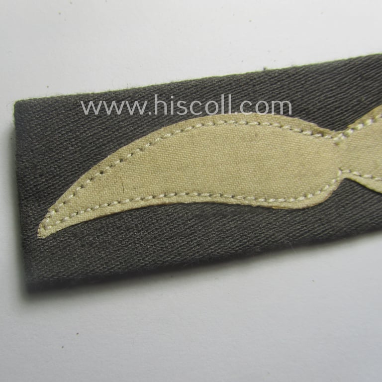 Single, WH (Luftwaffe) greyish-blue-coloured, NCO-type rank-patch (aka 'moustache'), as was intended for usage by a non-commissioned officer with the rank of: 'Unteroffizier'