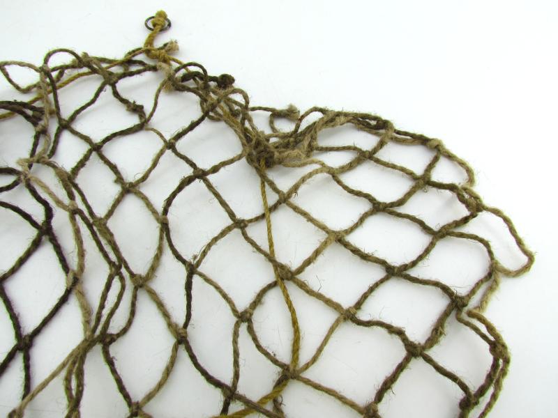 Complete late war German helmet net with attachment hooks