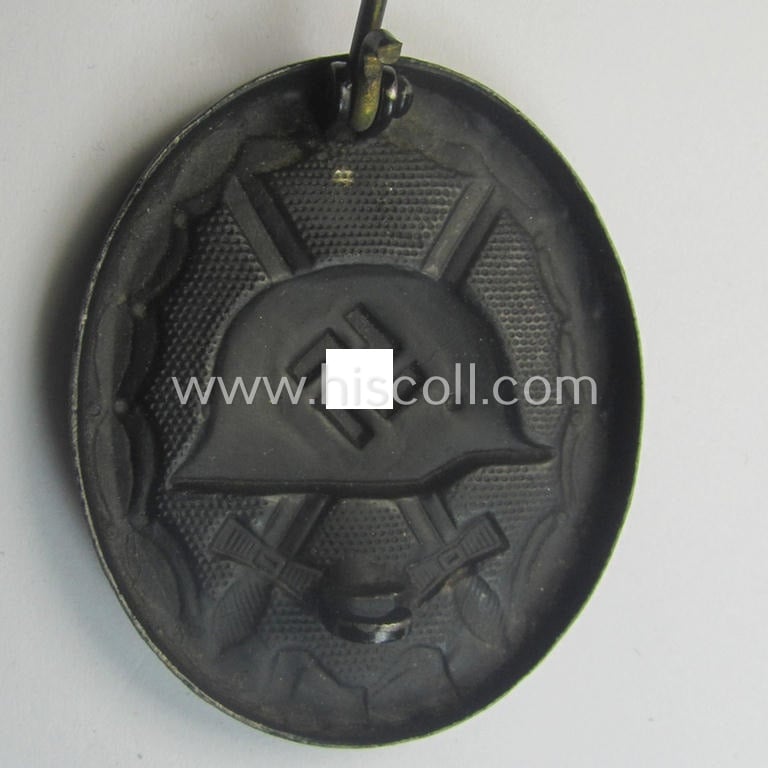 Maker- (ie. I deem '118'-) marked example of a black-class wound-badge (or: 'Verwundeten-Abzeichen in Schwarz') being an example that was produced by the (Austrian-based) maker (ie. 'Hersteller') named: 'August Menze & Sohn'