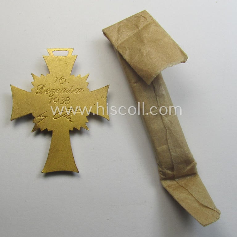 'Ehrenkreuz der deutschen Mutter - erste Stufe' (or: golden-class mothers'-cross) being a 'virtually mint' example that comes with its accompanying, long-sized- (and also 'mint'!) ribbon as issued and/or recently found