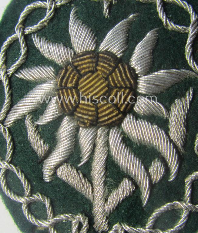 Moderately used, WH (Heeres) neatly hand-embroidered- and/or typical officers'- (ie. 'variant'-) pattern so-called: 'Edelweiss'-arm-badge (as specifically intended for usage by an officer serving within the 'Geb.-Jäger-Trpn.'