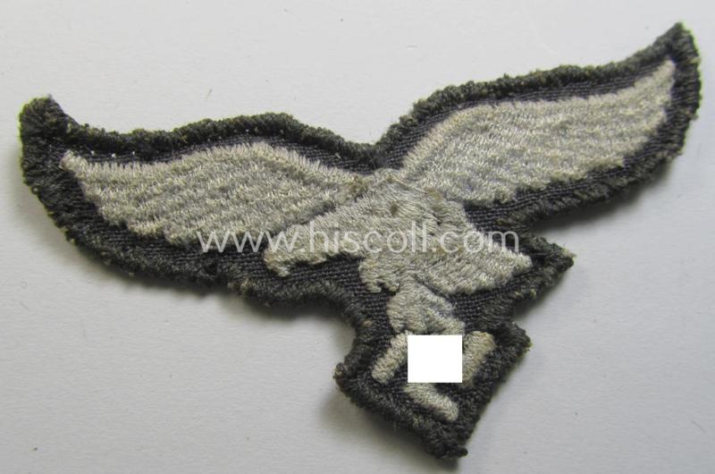 Neat, 'variant'-pattern, WH (Luftwaffe) EM- (ie. eventually NCO-) type side-cap eagle (being a 'virtually mint- ie. unissued' example as executed in typical machine-embroidered-pattern onto an unusally seen 'thin-shaped' background)