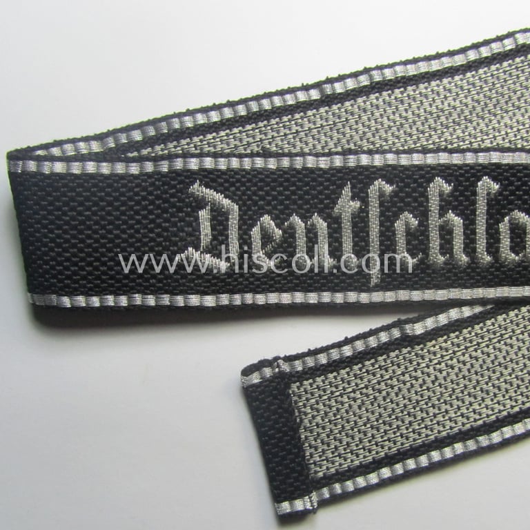 Stunning, Waffen-SS officers'-type, 1939/40-pattern cuff-title (ie. 'Ärmelstreifen') as executed in flat-wire 'BeVo'-weave-pattern (in Gothic-styled script!) for an officer within the: SS-Rgt. 'Deutschland' (2. SS-Pz-Div. "Das Reich")