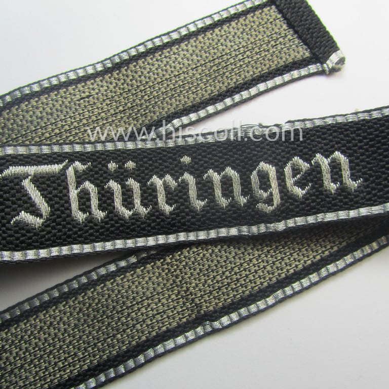 Stunning, 'SS-Totenkopfverbände'-officers'-type, 1937-pattern cuff-title (ie. 'Ärmelstreifen') as executed in flat-wire 'BeVo'-weave-pattern (in Gothic-styled script) for an officer within the: 'SS-Totenkopf Standarte' “Thüringen”