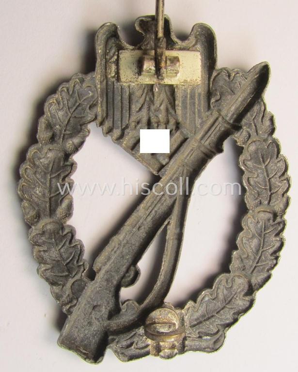 Attractive, 'hollow-back'-pattern 'Infanterie Sturmabzeichen in Silber' (or: silver infantry-assault badge ie. IAB) being a non-maker-marked example as executed in zinc-based metal (ie. 'Feinzink') as was produced by the: 'Wilh. Deumer'-compa...