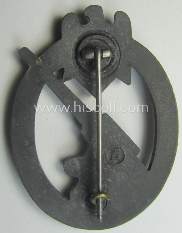 'Heeres-Flakkampf-Abzeichen' being a clearly maker- (ie. 'HA'-marked- and/or zinc- (ie. 'Feinzink'-) based specimen as was produced by the maker (ie. 'Hersteller') named: 'Hermann Aurich'